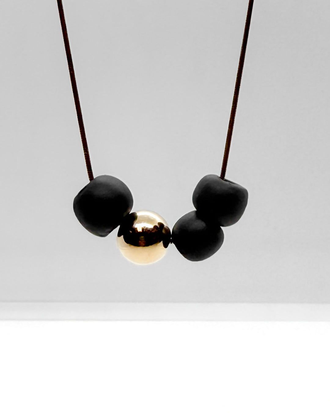 _the BEAD necklace | black porcelain + gold