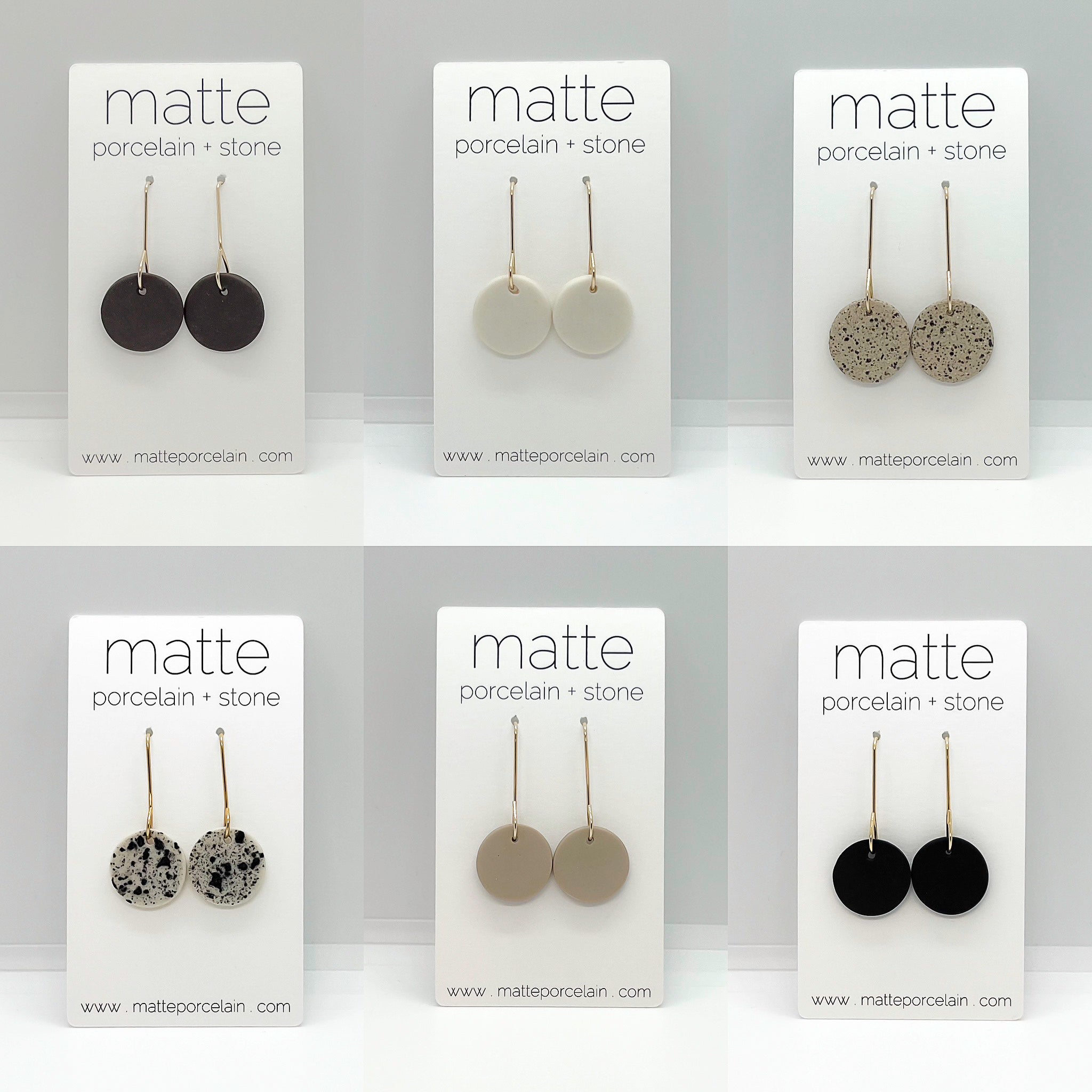 Set of six pairs of matte porcelain and stone earrings on branded cards.