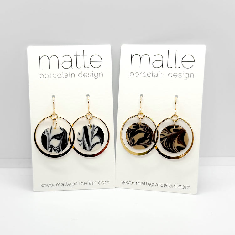Pair of earrings on Matte Porcelain Design cards with a white background